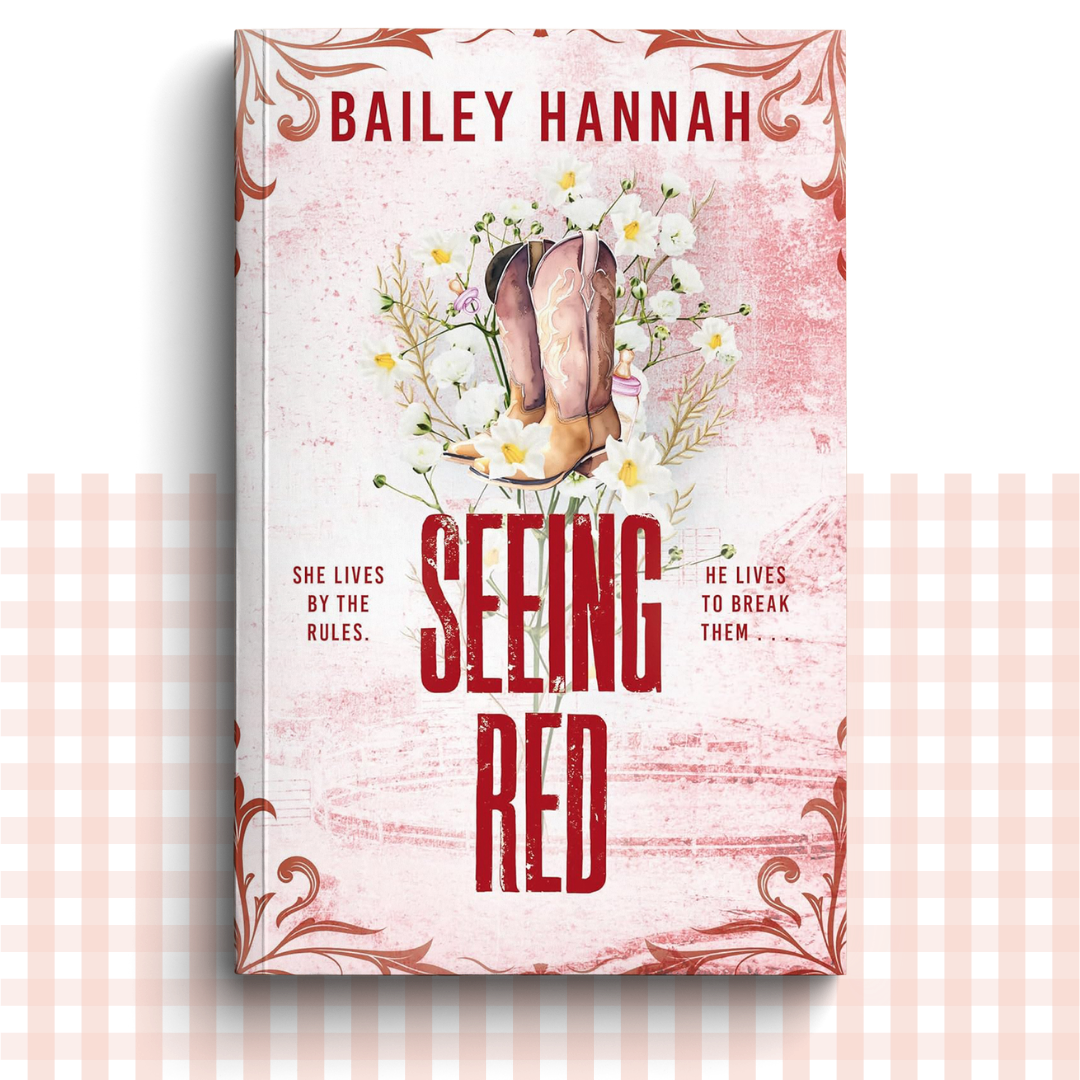 Paperback book cover of 'Seeing Red' by Bailey Hannah with red cowboy boots and flowers.