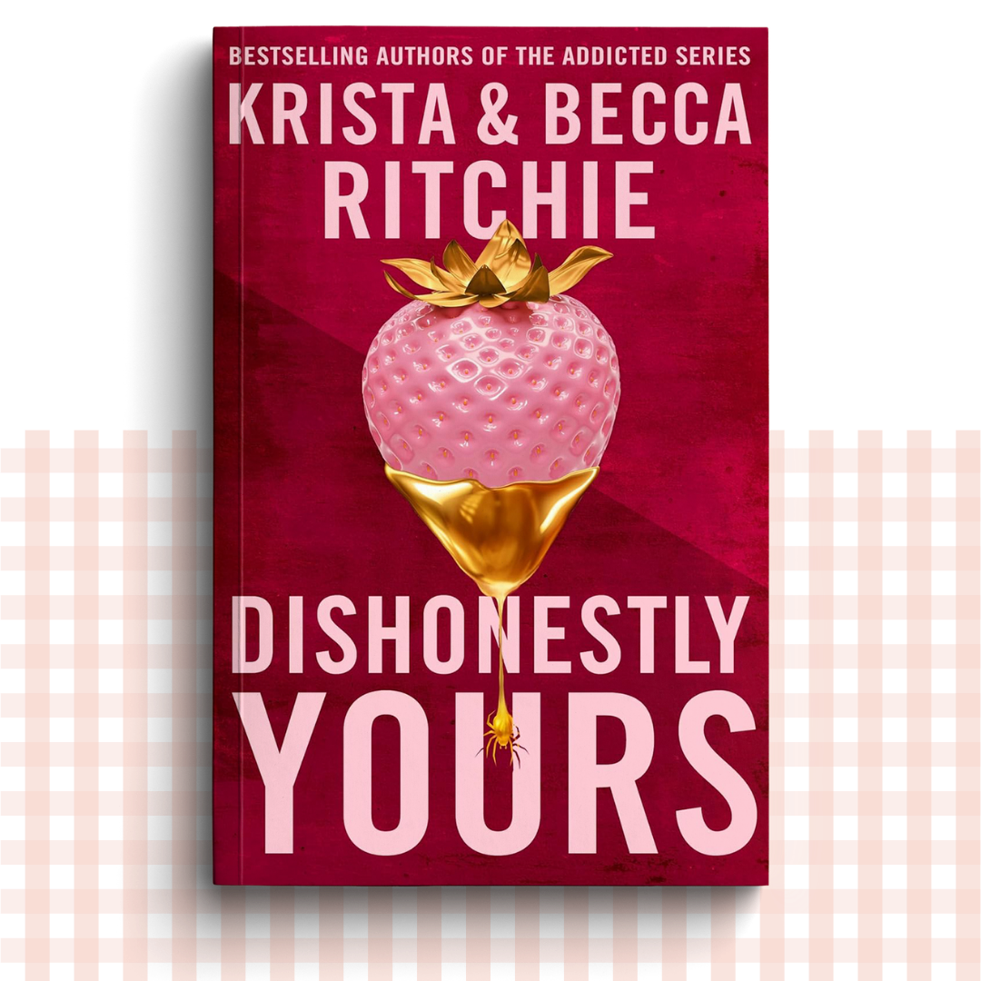 Paperback book cover of 'Dishonestly Yours' by Krista & Becca Ritchie with a red, gold and pink design featuring a strawberry.