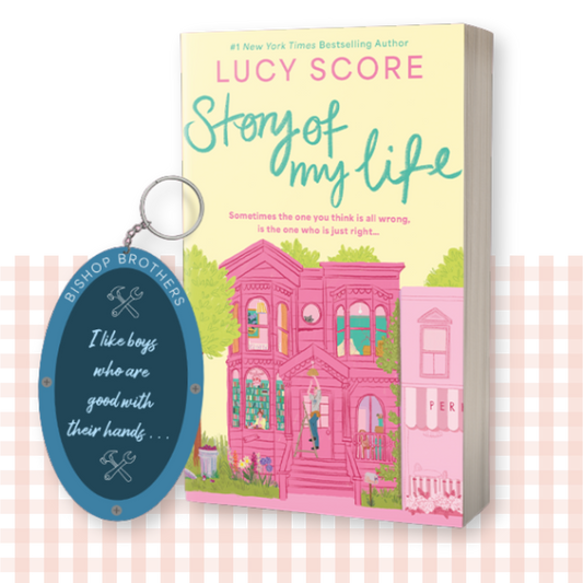 Paperback book cover of 'Story of My Life' by Lucy Score with a matching keychain
