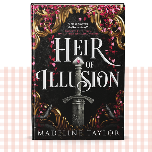 Hardback book cover of 'Heir of Illusion' by Madeline Taylor on a decorative black, gold and red background