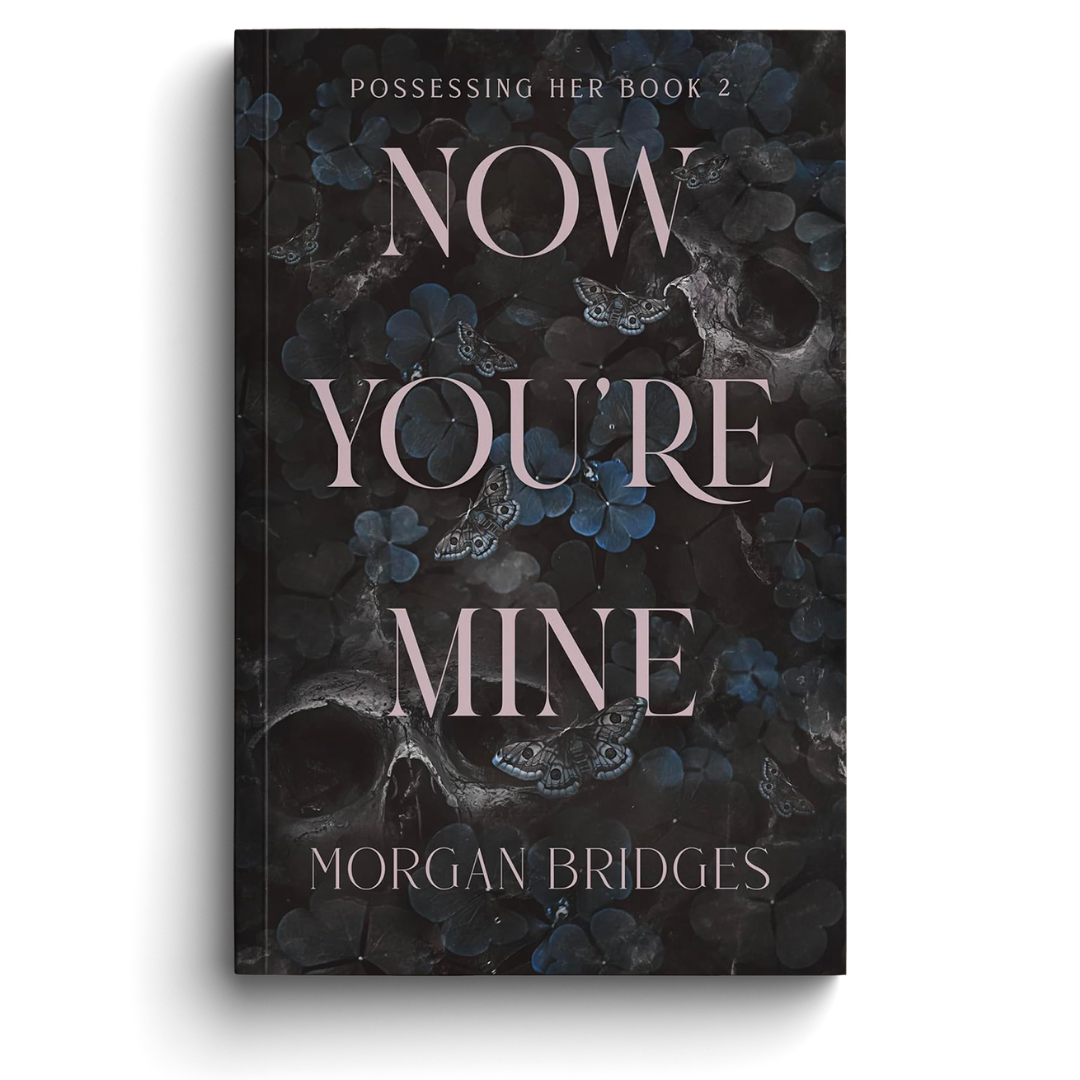 Book cover of 'Now You're Mine' by Morgan Bridges with dark floral design