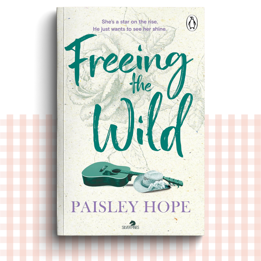 Paperback book cover of 'Freeing the Wild' by Paisley Hope with a green and cream design and a green acoustic guitar.