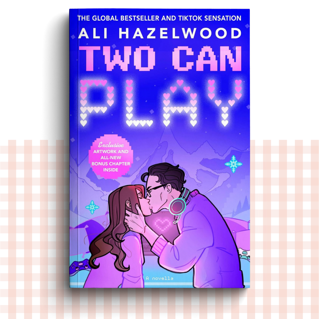Paperback book cover of 'Two Can Play' by Ali Hazelwood featuring an illustrated couple kissing