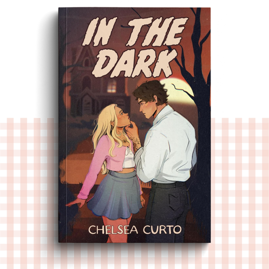 Paperback book cover of 'In the Dark' by Chelsea Curto with illustration of two people in a dark setting.