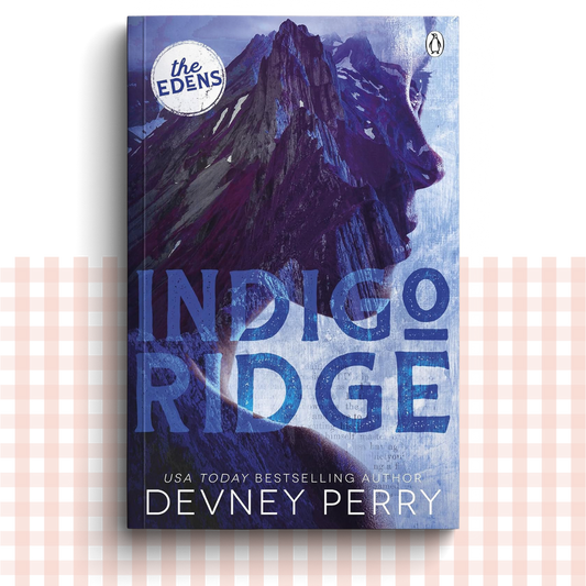 Paperback book cover of 'Indigo Ridge' by Devney Perry with a deep blue design.