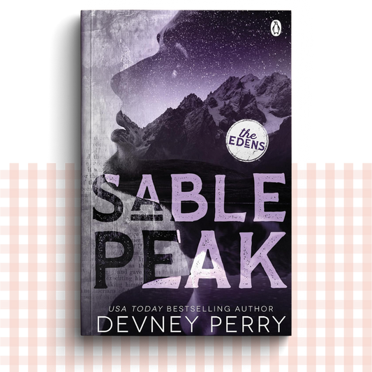Paperback book cover of 'Sable Peak' by Devney Perry with purple mountainous landscape design.