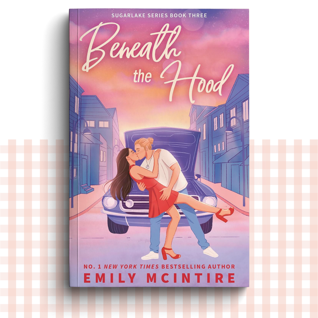 Paperback book cover of 'Beneath the Hood' by Emily McIntire with a couple embracing in front of a car.