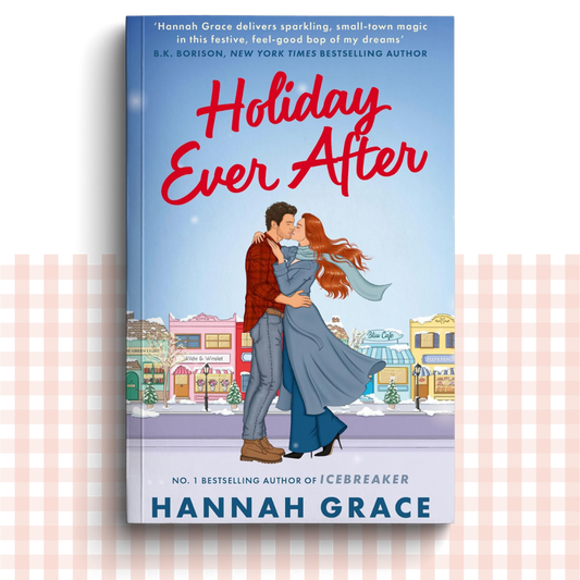Paperback book cover of 'Holiday Ever After' by Hannah Grace with a couple embracing in a snowy town.