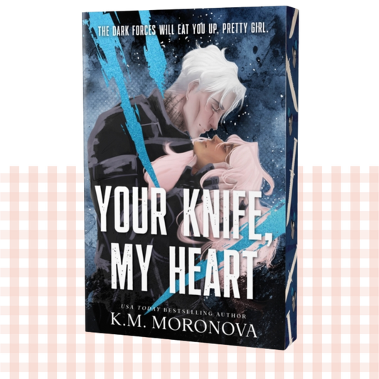 Paperback book cover of 'Your Knife, My Heart' by K.M. Moronova with a deep blue design featuring two characters embracing on the front, and sprayed edges.