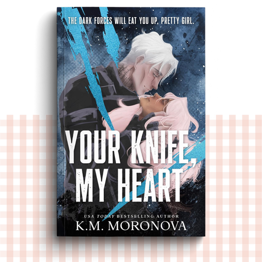 Paperback book cover of 'Your Knife, My Heart' by K.M. Moronova with a deep blue design featuring two characters embracing on the front.