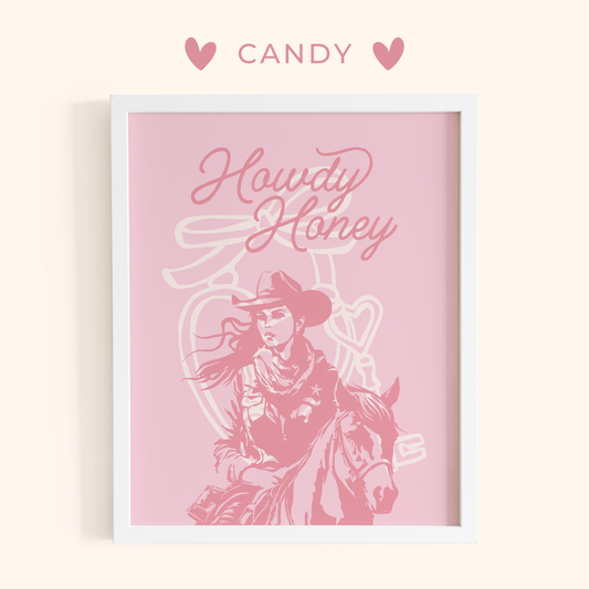 Framed artwork with a cowboy and horse illustration and 'Howdy Honey' text on a pink background, branded 'Candy'