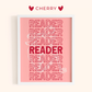 Framed poster with 'READER' text in red on a pink background, branded 'Cherry'