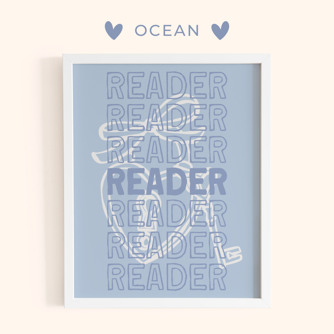 Framed artwork with 'READER' text on a light blue background.