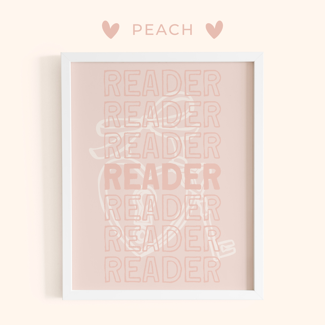 Framed artwork with 'READER' text in peach color on a light pink background