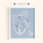 Framed artwork with a romantic illustration design and 'OCEAN' text on a light blue background
