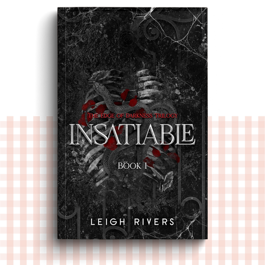 Paperback book cover of 'Insatiable' by Leigh Rivers with a dark background 