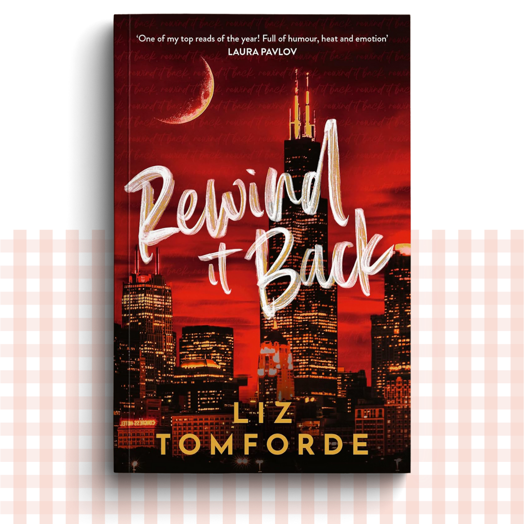 Paperback book cover of 'Rewind It Back' by Liz Tomforde with a Chicago city skyline and moon in the background.