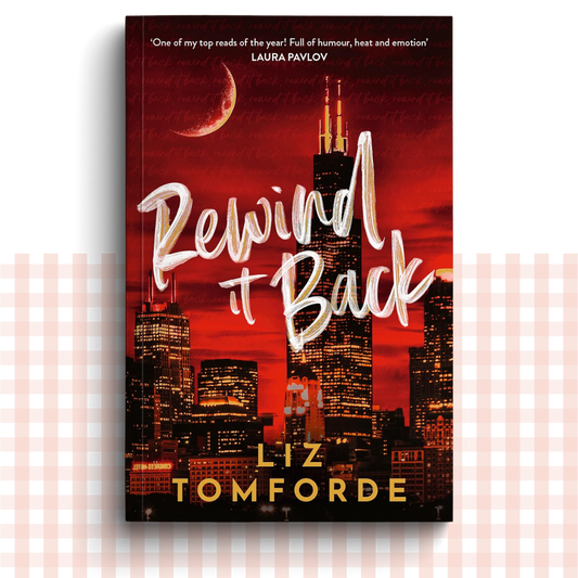 Paperback book cover of 'Rewind It Back' by Liz Tomforde with a Chicago city skyline and moon in the background.