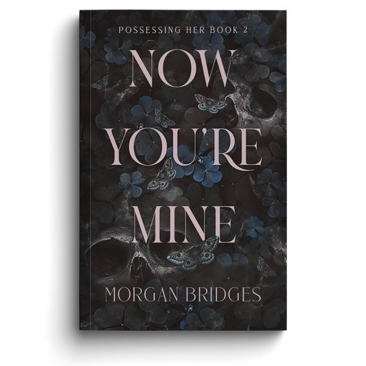 Book cover of 'Now You're Mine' by Morgan Bridges with dark floral design