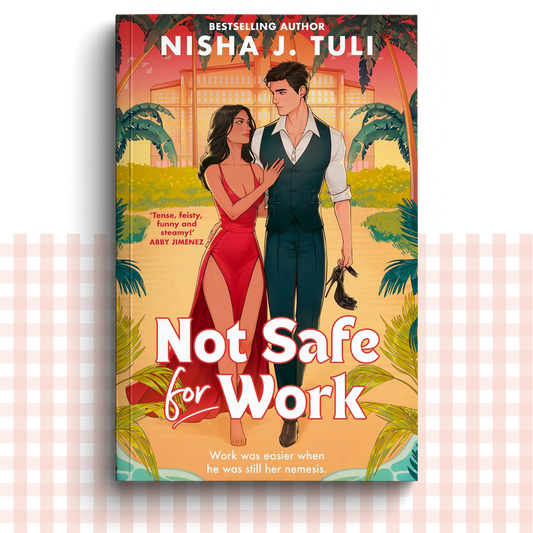 Paperback book cover of 'Not Safe for Work' by Nisha J. Tuli with a couple in a tropical setting.