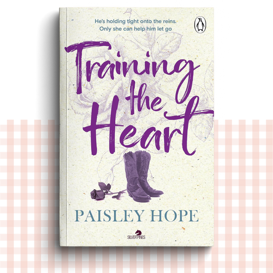 Paperback book cover of 'Training the Heart' by Paisley Hope with a purple and cream design, and a pair of purple cowboy boots.