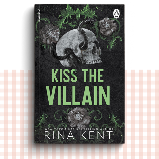 Paperback book cover of 'Kiss the Villain' with a skull and floral design on a dark background.